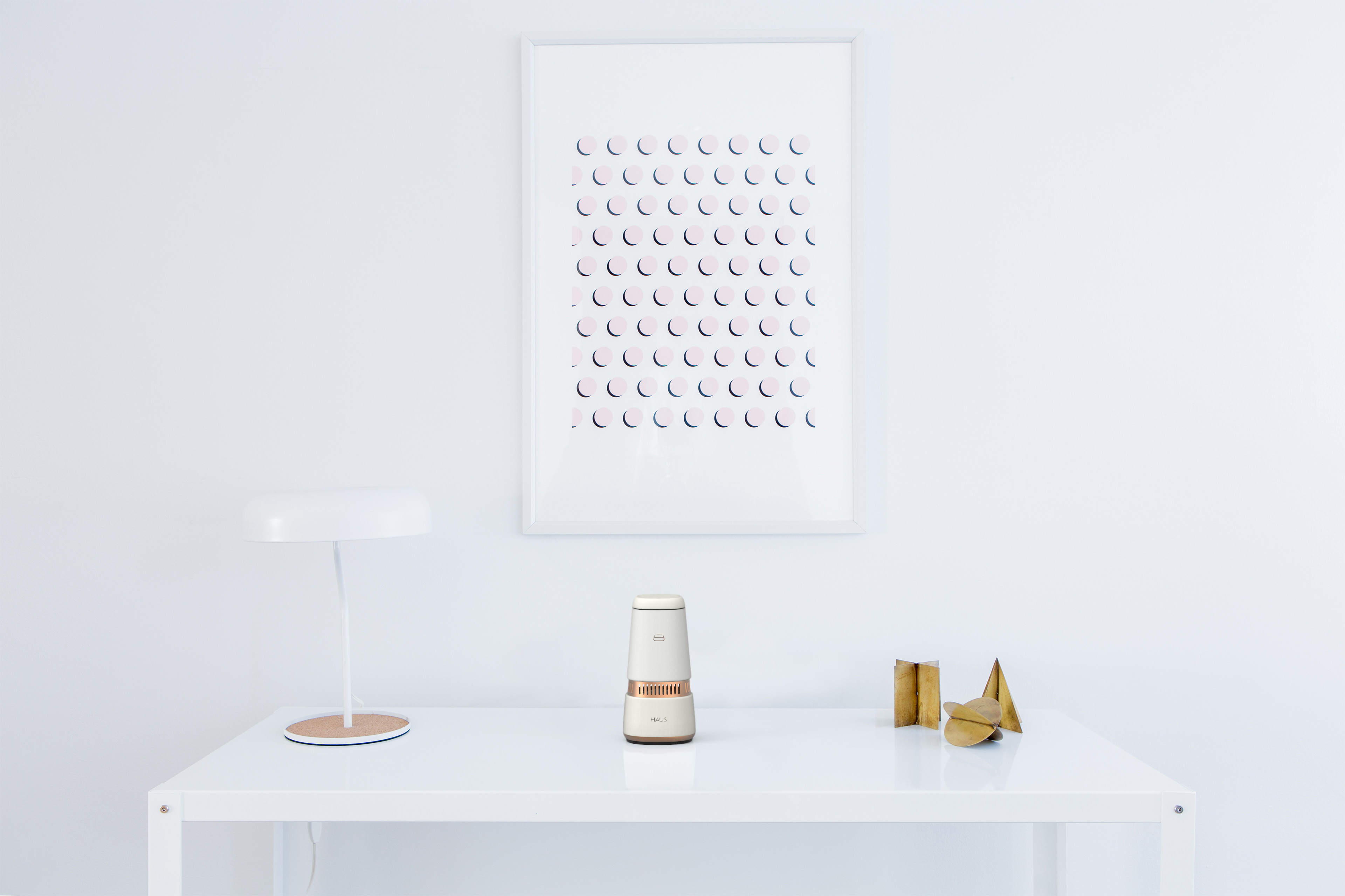The HAUS Smart Speaker in a White Hallway Table